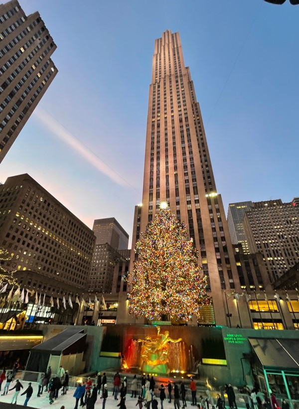 Rockefeller Center Christmas Tree lit up during winter in New York City.
